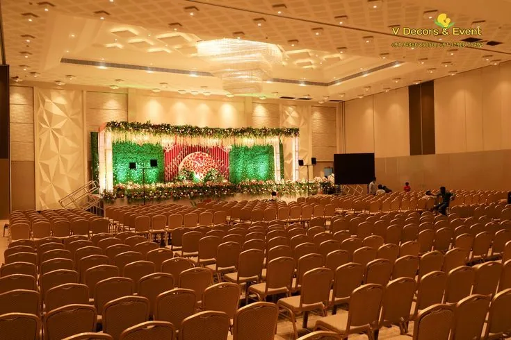 Banquet seating set for a wedding in the main hall at Suganya Convention Centre, Pondicherry